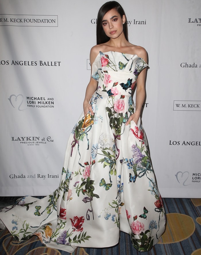Sofia Carson in a strapless floral gown from Monique Lhuillier's Spring 2018 collection at the 2018 Los Angeles Ballet Gala at the Beverly Wilshire Four Seasons Hotel in Beverly Hills, California, on February 24, 2018