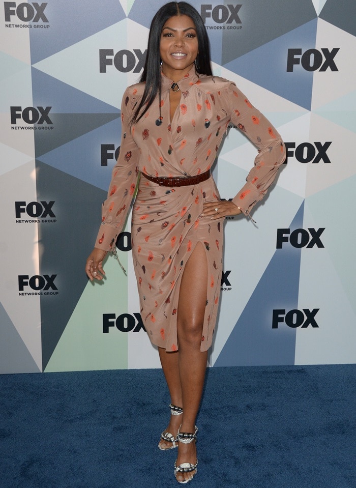 Taraji P. Henson in a feather-printed Altuzarra Fall 2018 dress featuring a collared neckline and wrap front bodice
