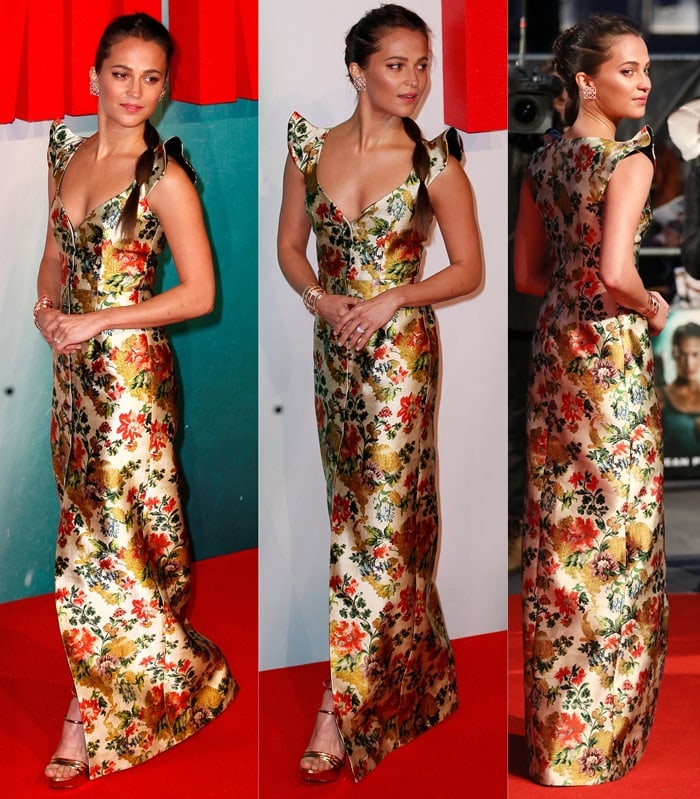 Vikander commands the red carpet in a shimmering Asian-floral Louis Vuitton creation paired with gold platforms