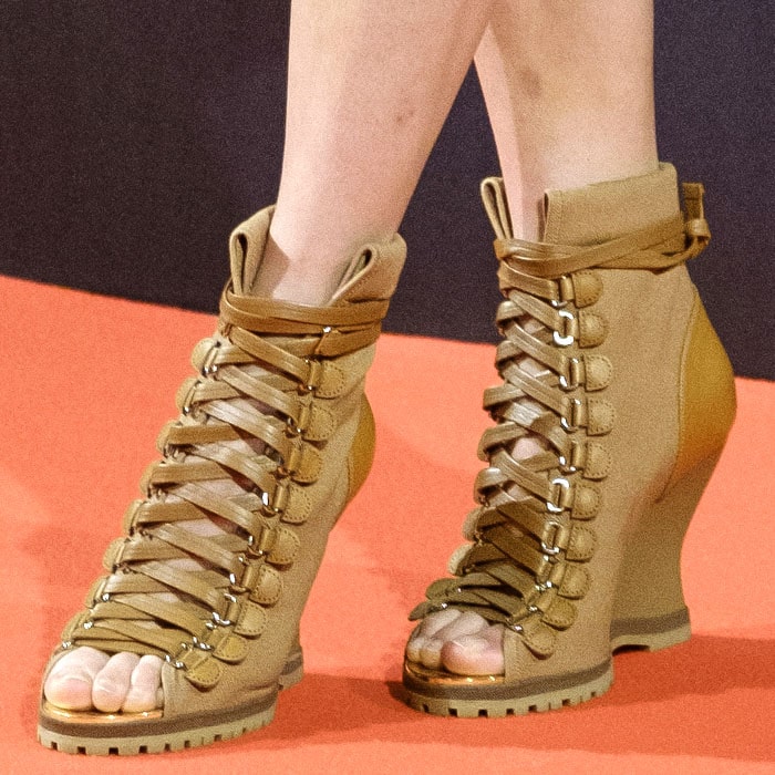 A closer view of the Chloé “River” boots shows their lug sole, metallic trim, and utilitarian lace-up design