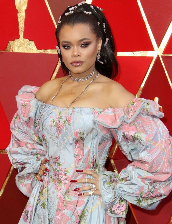 Andra Day wearing a floral pink and blue Zac Posen gown