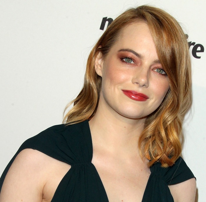 Emma Stone wears soft waves and warm-toned makeup while attending Marie Claire’s 3rd Annual Image Makers Awards