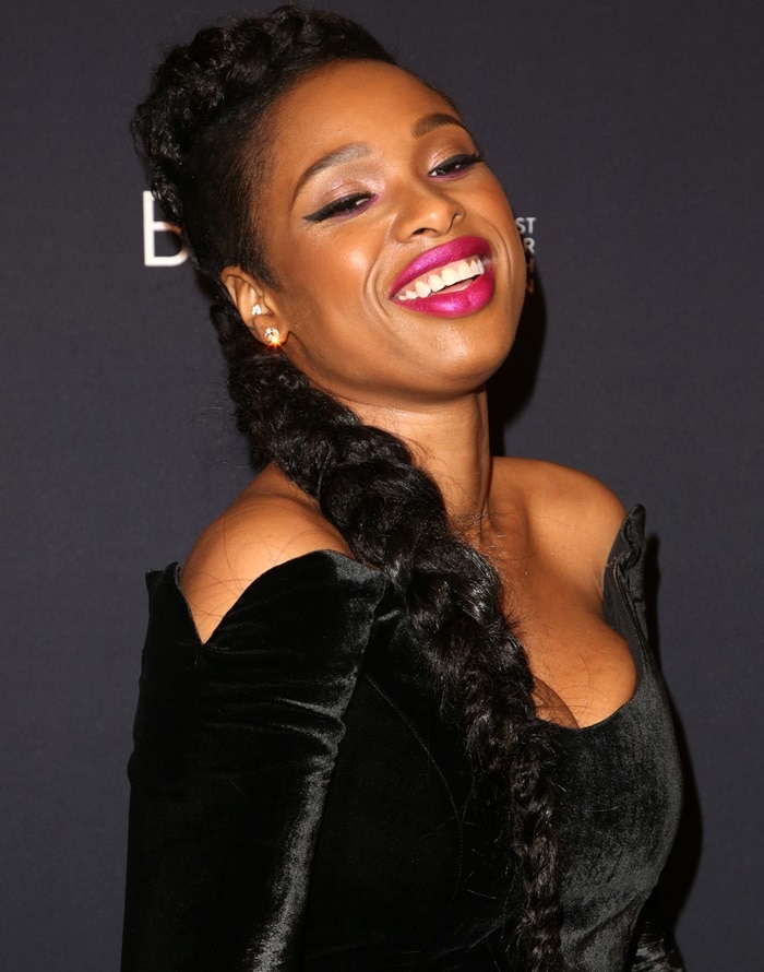 Jennifer Hudson wearing a long braided hairpiece