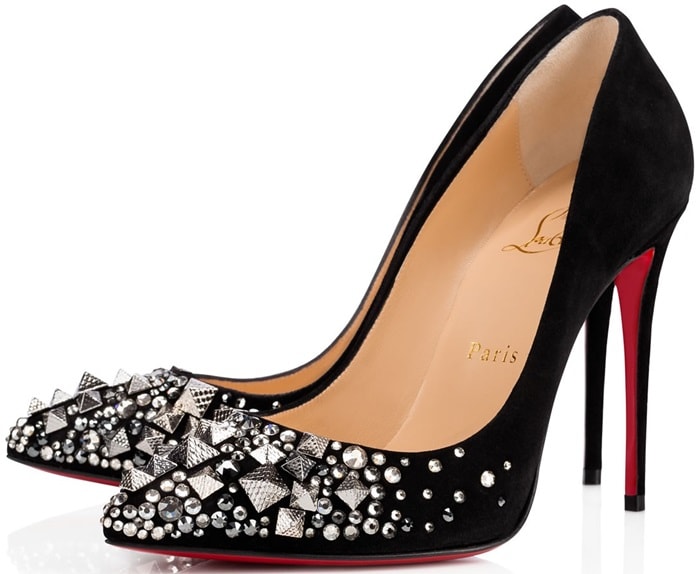 Black suede Christian Louboutin “Keopump” pumps combine pyramid studs, crystal embellishments, and the sharply pointed Pigalle-inspired silhouette for a dramatic take on the classic red-sole stiletto