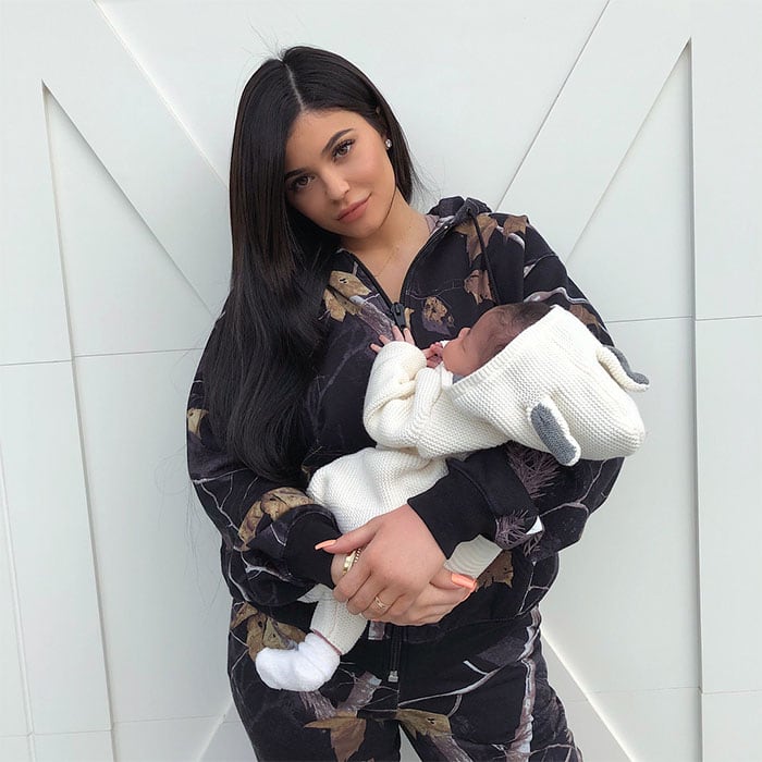 Kylie Jenner shares her first mommy-and-me moment with baby Stormi, dressed in an Alexander Wang 'Winter Camo' hoodie and matching pants