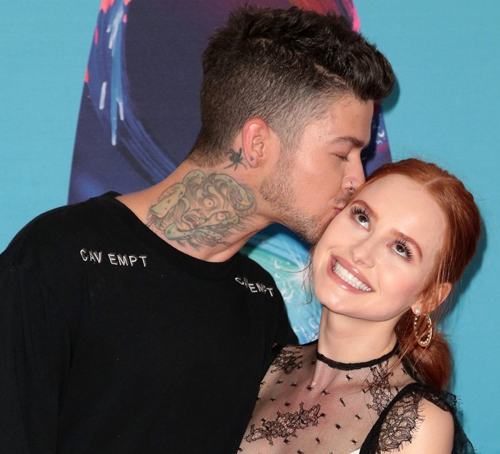 Madelaine Petsch getting a kiss from her boyfriend, Travis Tatum Mills, an American recording artist and actor