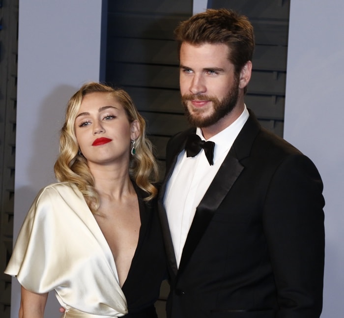 Miley Cyrus and her fiancé Liam Hemsworth at the 2018 Vanity Fair Oscar Party