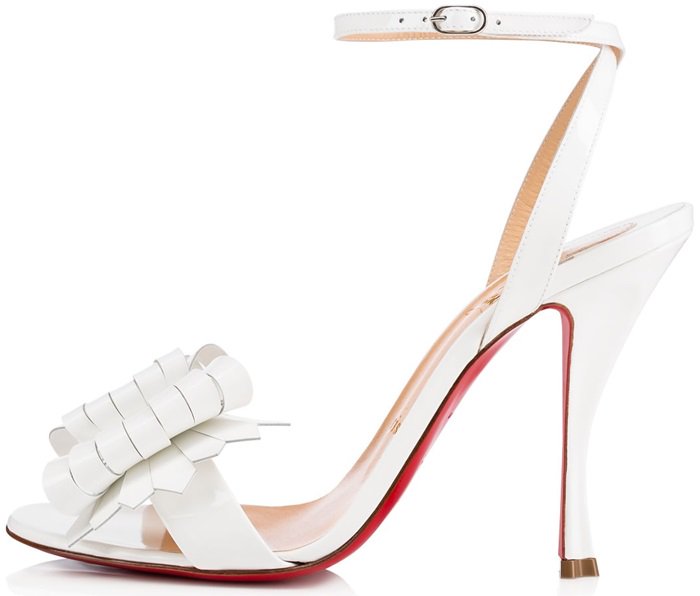 Featuring laser cut leather strips in an asymmetrical, layered interpretation of the iconic bow, this pair in glossy latte patent leather is finished with a sculpted 100mm clover heel, for an added dose of Louboutin luck