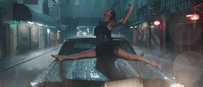 Taylor Swift dances barefoot on a rain-soaked car in the “Delicate” music video after kicking off her crystal-studded Christian Louboutin “Keopump” pumps, turning the surreal late-night scene into one of the video’s most memorable fashion moments