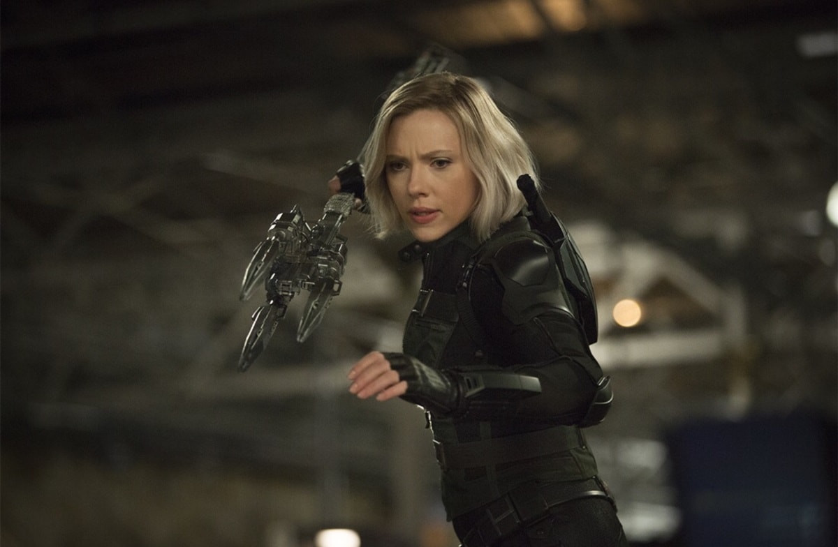 Natasha Romanoff / Black Widow (Scarlett Johansson) suits up in tactical black armor with her short blonde bob and signature dual batons, ready for battle in Avengers: Infinity War