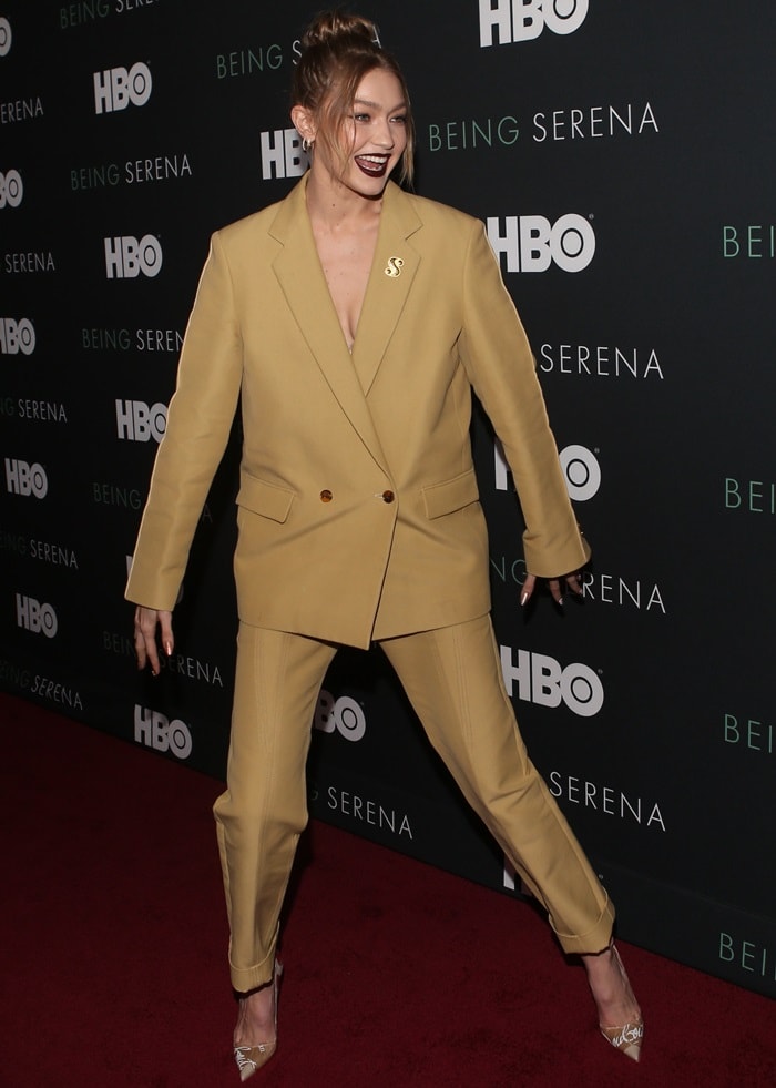 Gigi Hadid exudes confidence in a bold mustard Derek Lam suit paired with Christian Louboutin’s PVC Loubikraft pumps