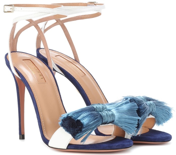 A pair of luscious fringed bows adorn the foot and an adjustable buckled strap wraps gently around the ankle to secure a perfect fit
