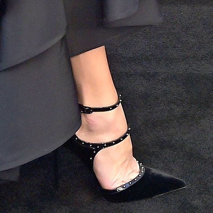 Malin Akerman shows off her feet in Le Silla "Borgia" studded black velvet pumps, featuring pointed toes and double ankle straps that add both edge and elegance to her red carpet look