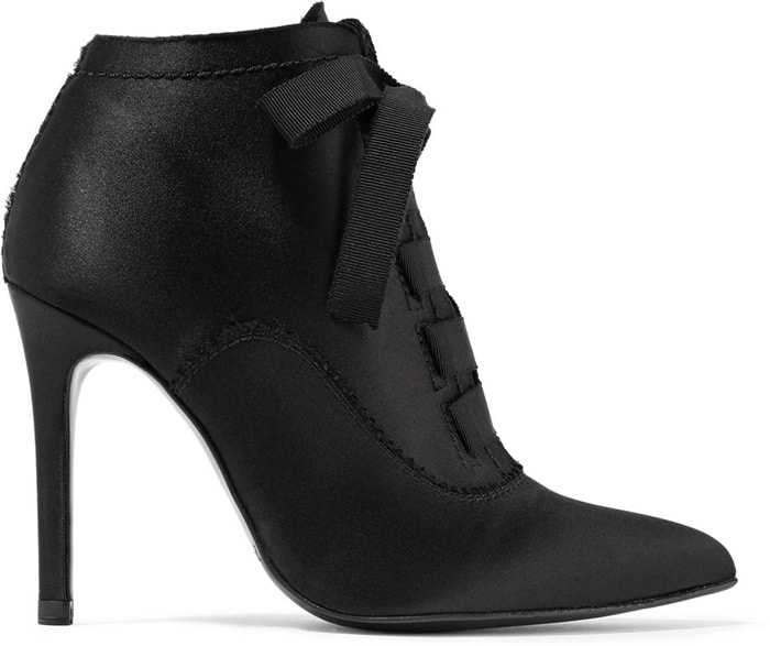 Pedro Garcia's 'Ana' ankle boot combines Victorian-inspired elegance with modern edge, featuring a sharply pointed toe, satin construction, grosgrain ribbon laces, and a slender stiletto heel that creates a sleek, leg-lengthening silhouette