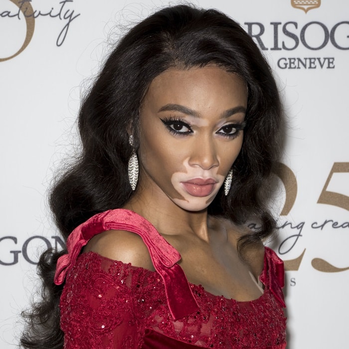 Winnie Harlow in a breathtaking red embellished peplum gown from Elie Saab