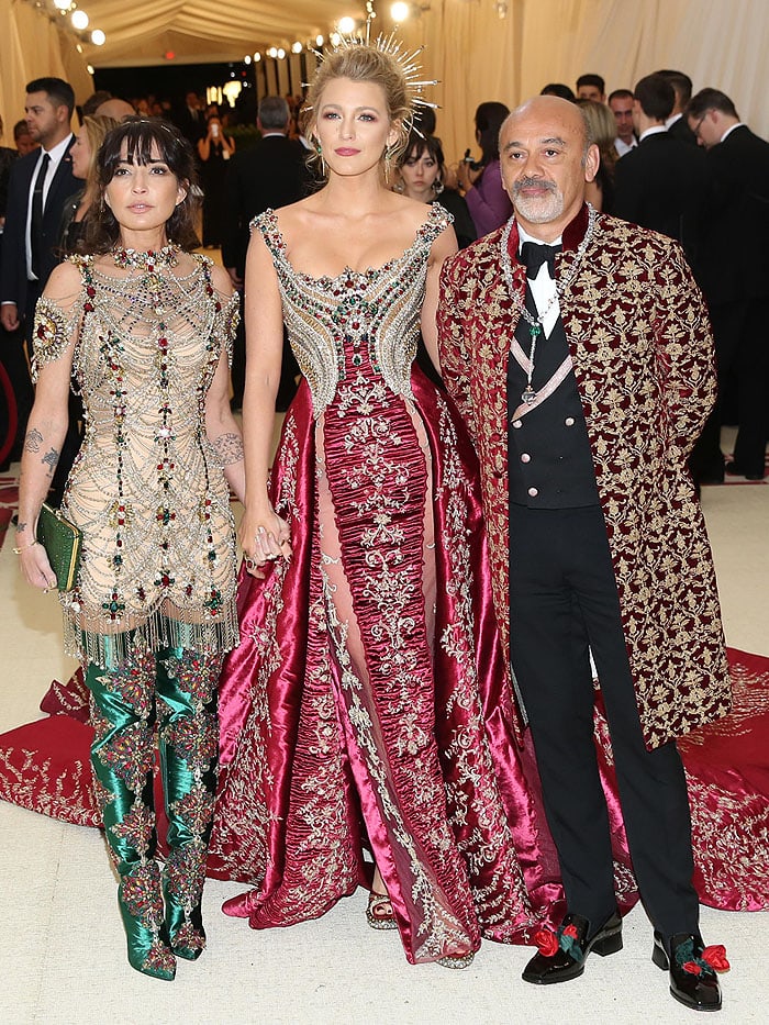 Blake Lively posing with Christian Louboutin and a guest at the 2018 Met Gala.