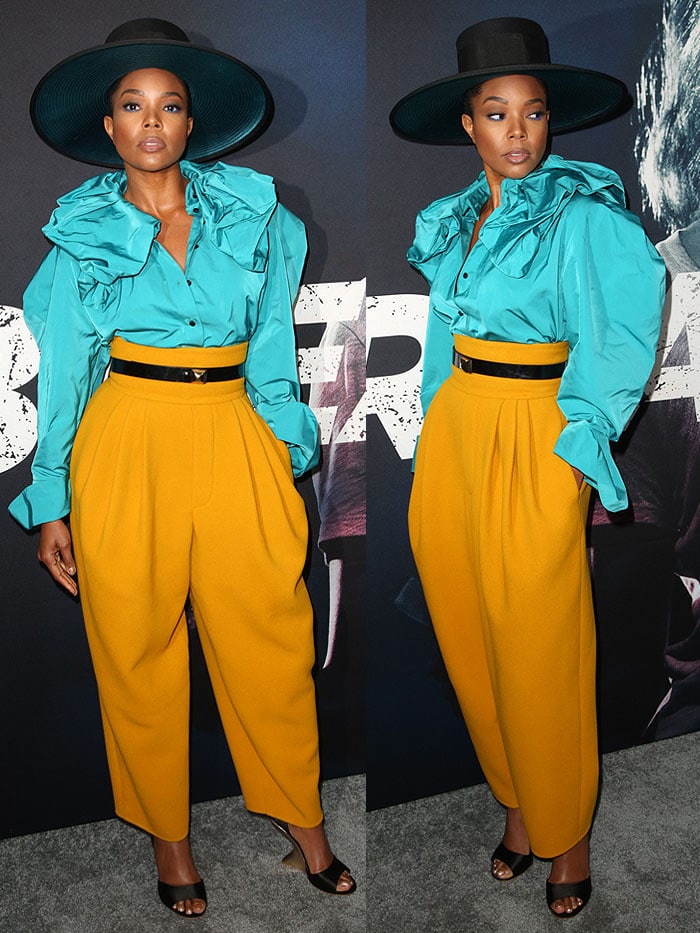 Gabrielle Union wearing a Marc Jacobs blue ruffled blouse and yellow pants with Salvatore Ferragamo curved wedges.