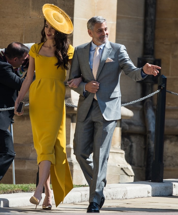 Amal Clooney looked elegant in a bespoke honey yellow midi dress by Stella McCartney, featuring exquisite side tie detailing in silk cady