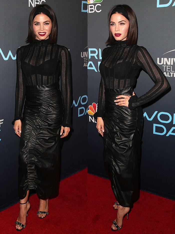 Jenna Dewan exudes edgy elegance in an all-black outfit featuring a sheer striped top, ruched leather skirt, and jeweled ankle-strap heels