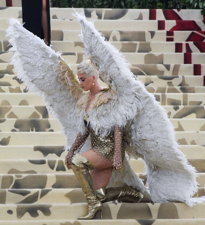 Katy Perry showing off her white dramatic feather wings