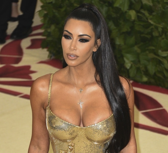 Kim Kardashian accessorized with two cross necklaces