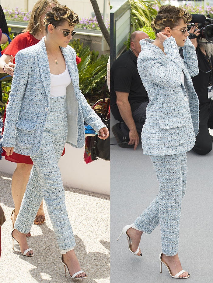 Kristen Stewart steps out in a baby-blue Chanel boucle suit paired with white Aquazzura 'Casablanca' sandals, completing the look with round sunglasses and her signature edgy hairstyle