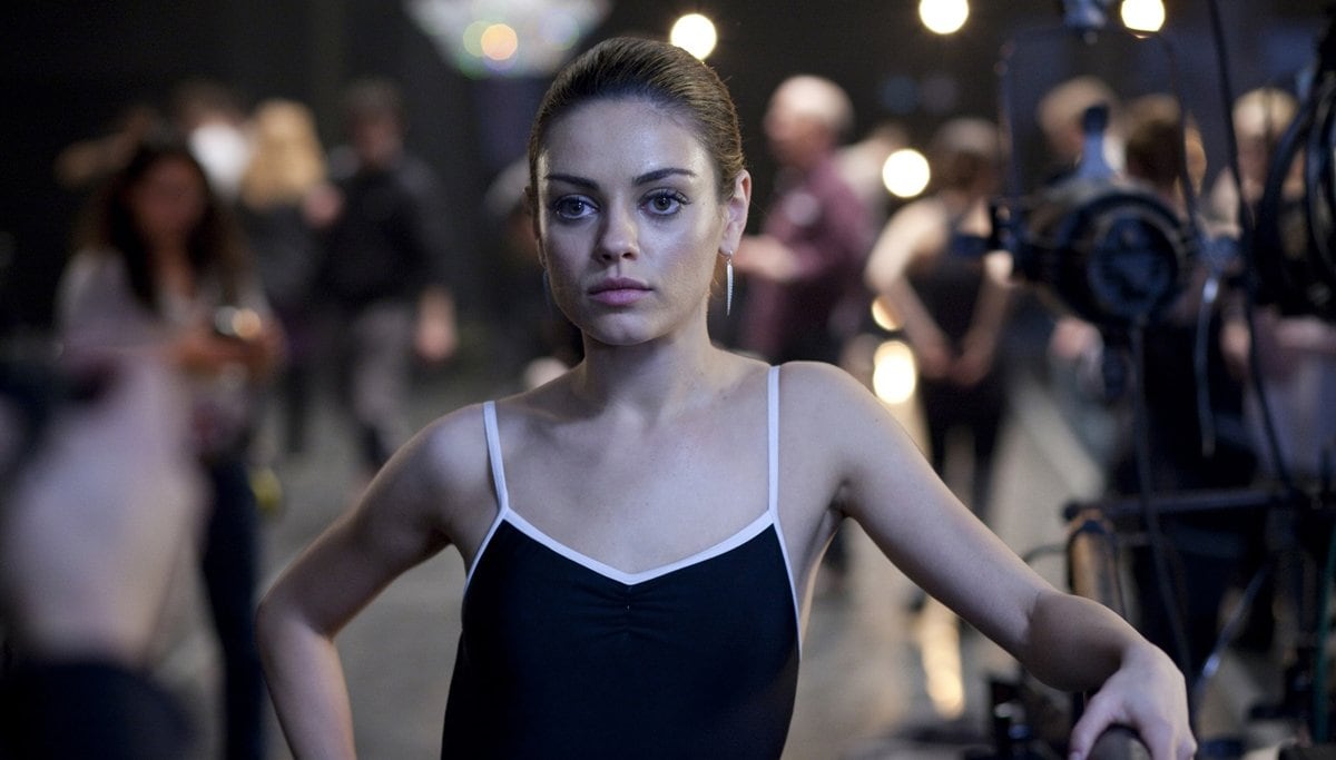 Mila Kunis transforms into Lily, the daring rival ballerina to Natalie Portman’s Nina, in Darren Aronofsky’s psychological thriller Black Swan — a role that showcased both her discipline and dark allure