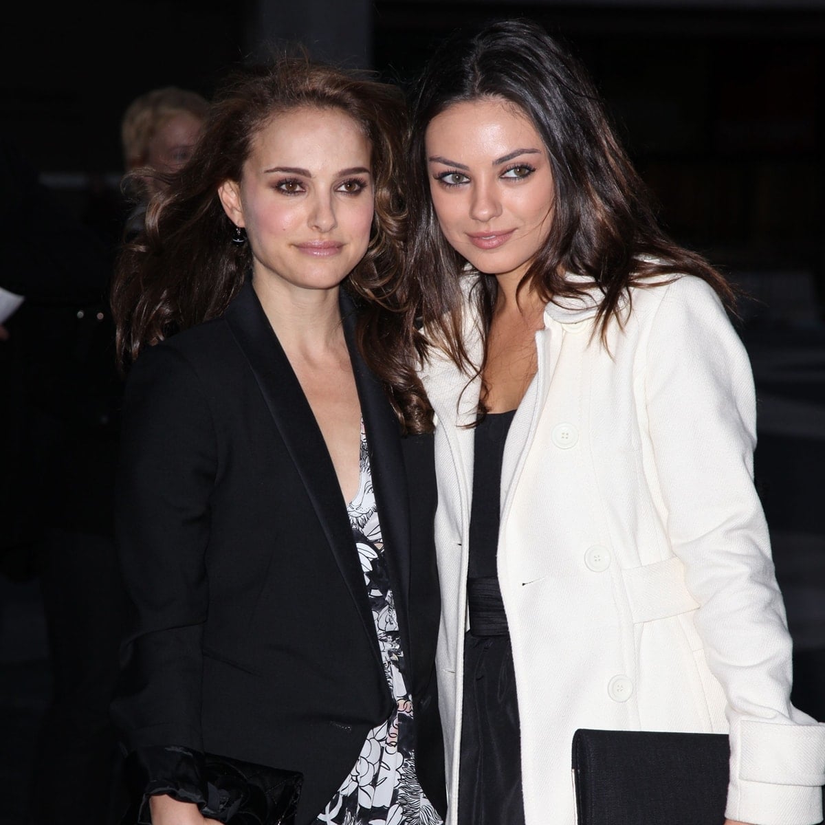 Natalie Portman in a sleek black blazer paired with a printed dress and Mila Kunis in a chic white coat at the 2009 American Ballet Theatre Fall Gala