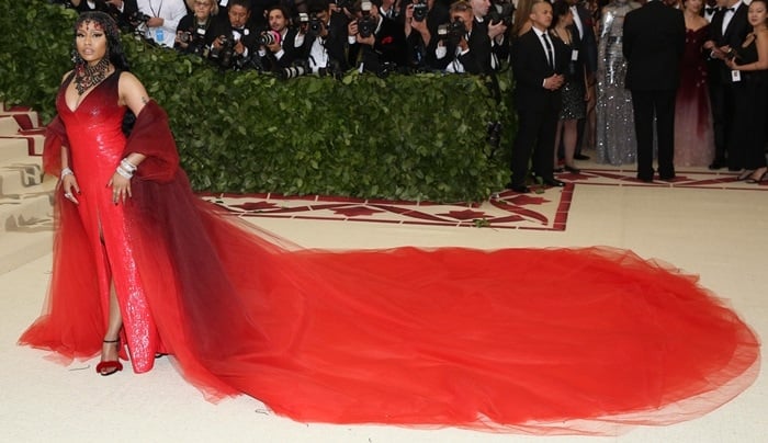 Nicki Minaj styled her sultry dress with a matching multi-layered tulle coat, a bejeweled headpiece, Le Silla 'Gaga' fur-embellished ankle-strap sandals, and Tiffany Co. jewelry