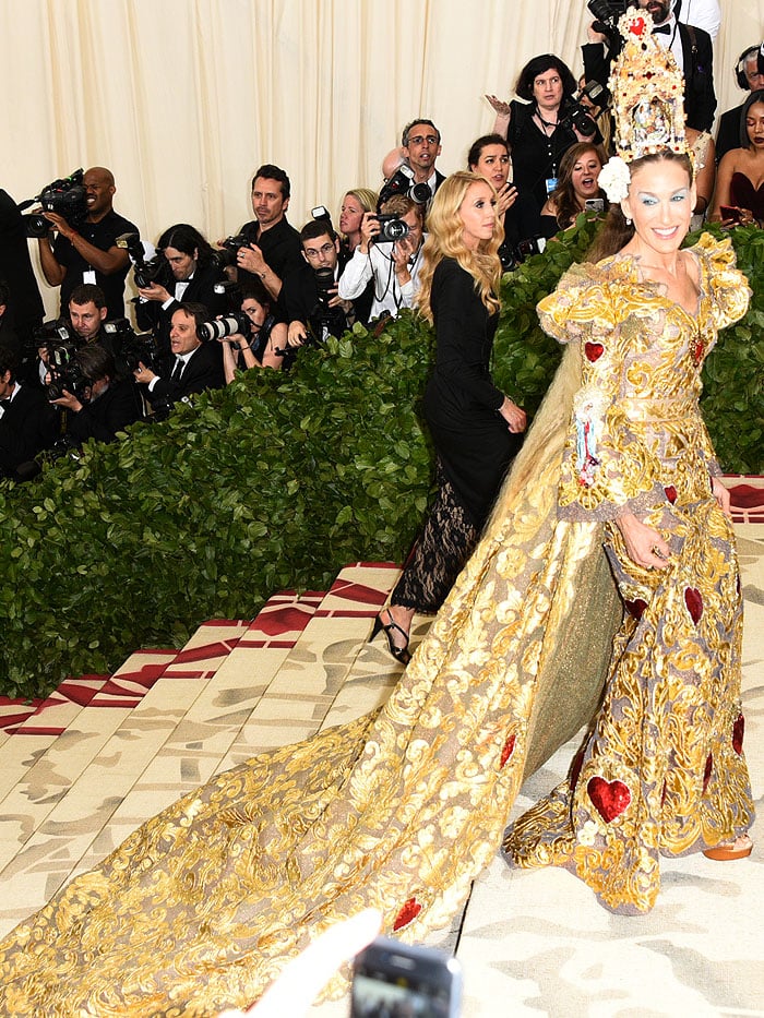 Sarah Jessica Parker in Dolce Gabbana Alta Moda gold-filigree gown and metallic-copper platform sandals.