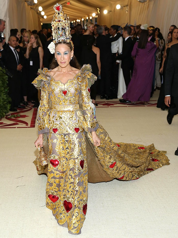 Sarah Jessica Parker in a Dolce Gabbana Alta Moda gold baroque heart-embellished gown and nativity altar headpiece.