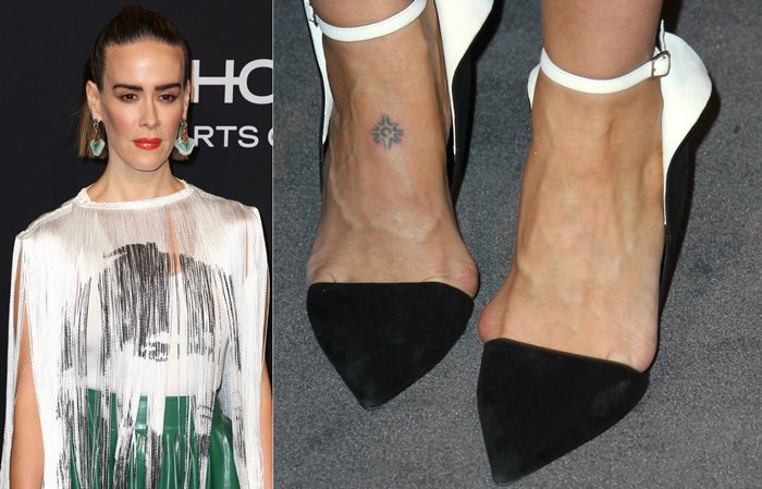 Sarah Paulson showcases her feet in pointed-toe heels, revealing visible foot veins and slight imperfections, possibly from prolonged wear of tight shoes, with a small tattoo adding a personal detail to her look