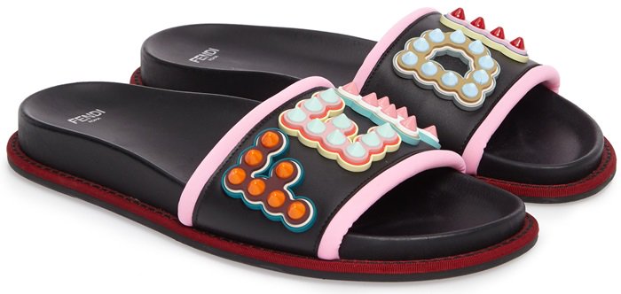 Candy-colored cone studs and Fendi logo letters heighten the playfully chic attitude of these sandals fashioned from super-soft leather
