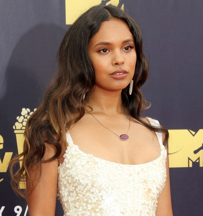 Alisha Boe showing off her ruby, diamond yellow gold necklace at the 2018 MTV Movie TV Awards at Barker Hangar in Santa Monica, California, on June 16, 2018