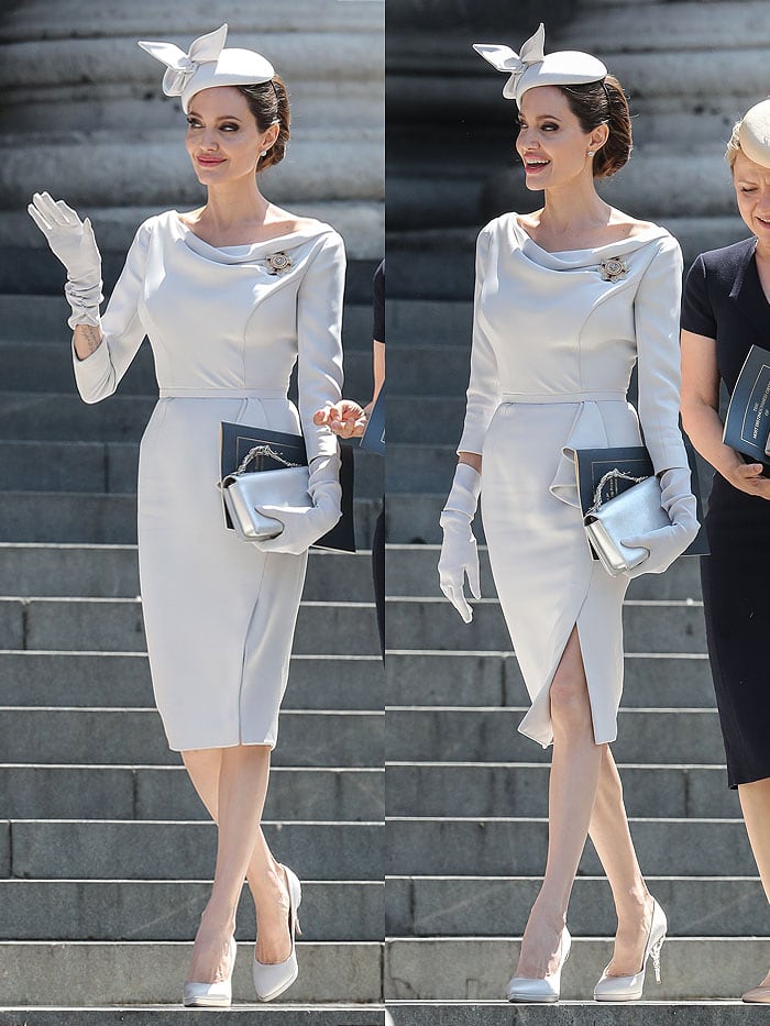 Angelina Jolie wearing a dove-gray Ralph Russo dress, a fascinator hat, and gloves