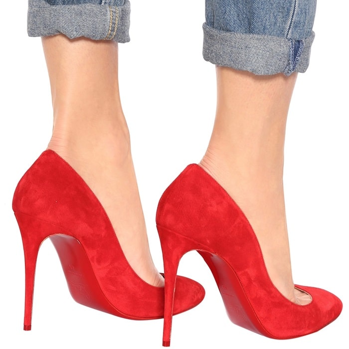 Red suede Christian Louboutin Eloise pumps with the brand’s signature red soles add a bold, sophisticated touch to any outfit