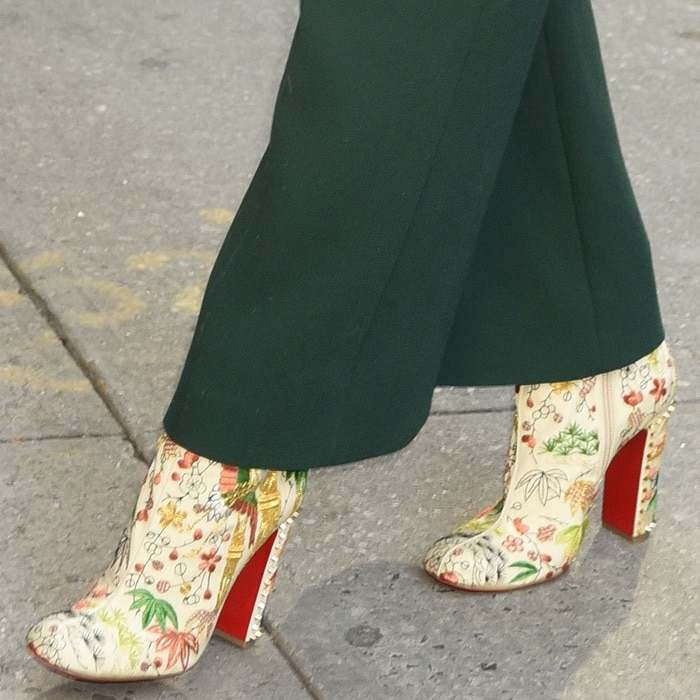 A closer look at Chastain’s statement-making Christian Louboutin ‘Bamboot’ booties, detailed with intricate crane and floral embroidery and the label’s signature red soles