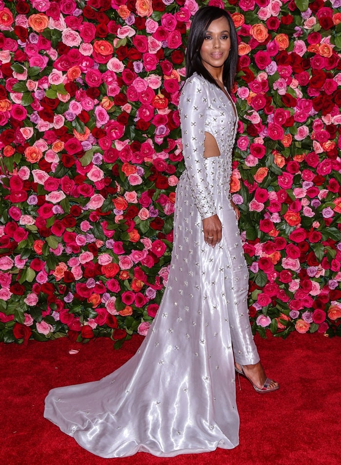 Kerry Washington glowed on the 2018 Tony Awards red carpet in a silver, crystal-embellished Atelier Versace jumpsuit paired with sleek metallic Loubi Queen sandals