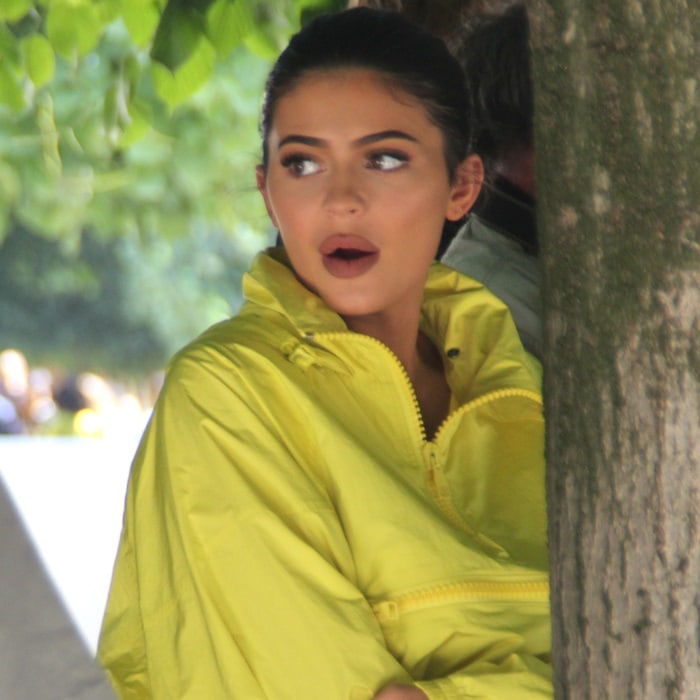 Kylie Jenner wearing a yellow bomber jacket from Virgil Abloh’s premiere menswear collection for Louis Vuitton