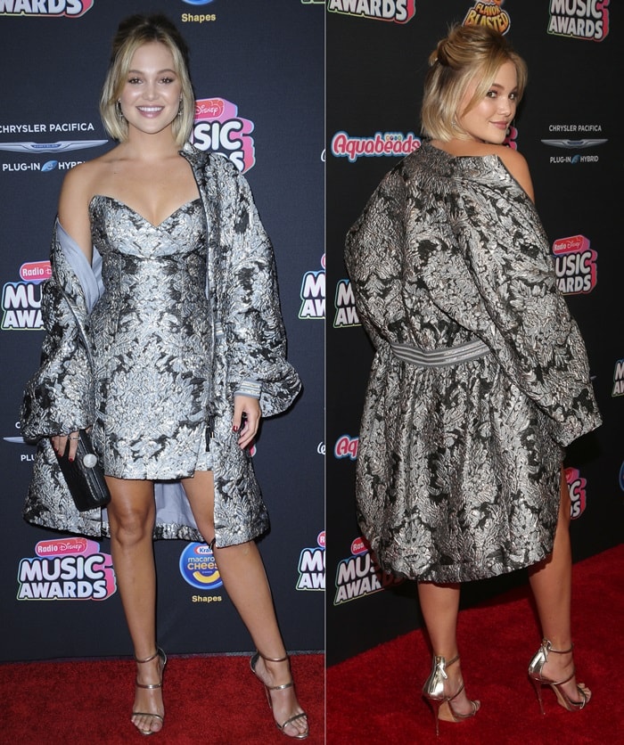 Olivia Holt dazzles at the Radio Disney Music Awards in a metallic brocade mini dress and matching jacket by Galia Lahav, perfectly paired with Giuseppe Zanotti's gold Harmony sandals