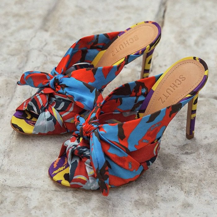 Schutz floral-print mule heels finished with an oversized knotted detail for a bold, fashion-forward twist