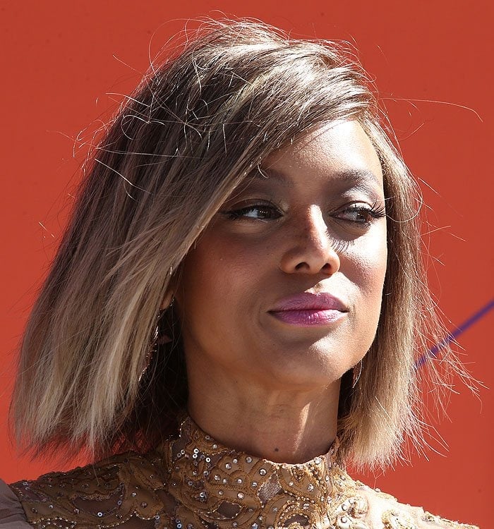 Tyra Banks rocks a honey-hued blunt bob that complements her radiant skin tone