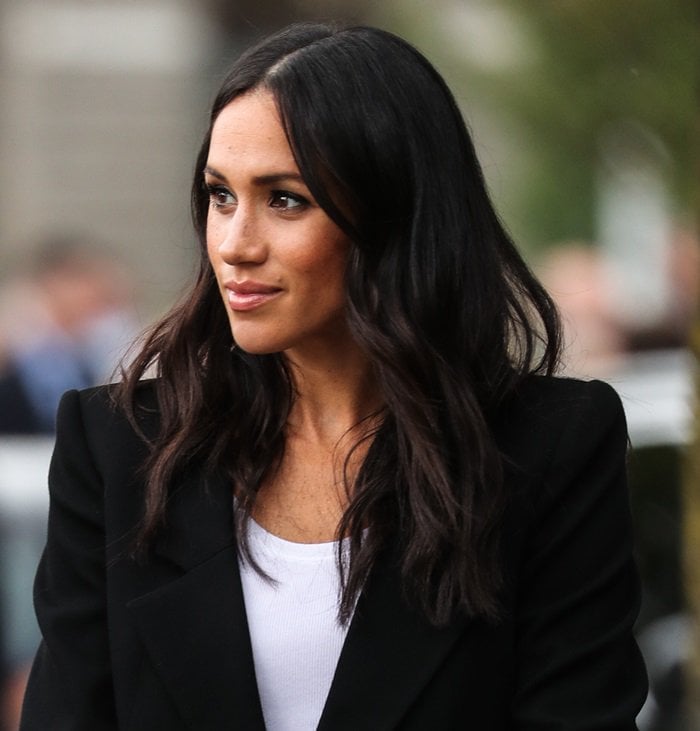 Meghan Markle wearing a black cropped double-breasted blazer by Givenchy