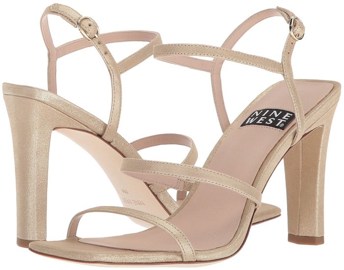A squared toe and flattened heel bring a striking geometric counterpoint to the curvy, barely-there straps of a beautifully deconstructed cage sandal