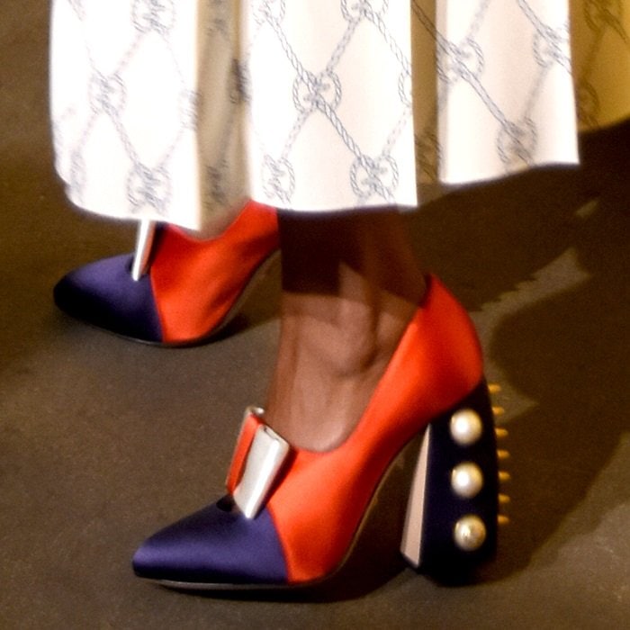 Taraji P. Henson highlights her look with Gucci’s color-block satin ‘Luna’ pumps, featuring pearl-studded block heels and golden pointed studs