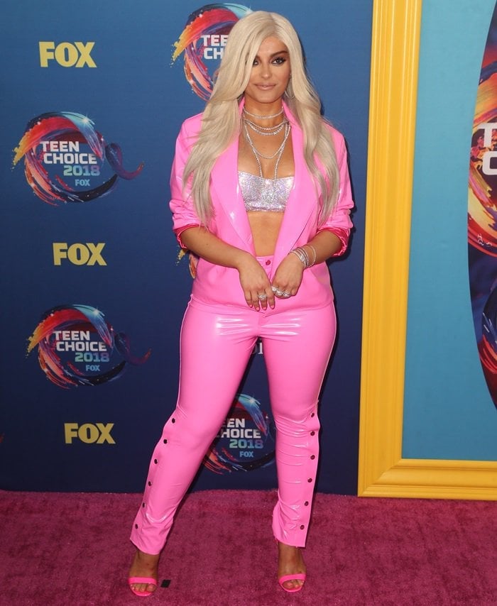 Bebe Rexha in a pink bubblegum La Roxx latex two-piece suit with an August Getty Atelier Swarovski crystal mesh bra underneath