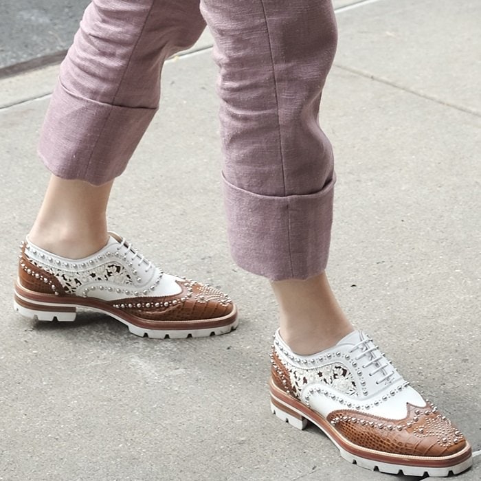 Blake Lively shows off her unique style with Christian Louboutin's Crapadonna studded leather oxfords, pairing edgy details with a classic brogue silhouette to complete her chic NYC look