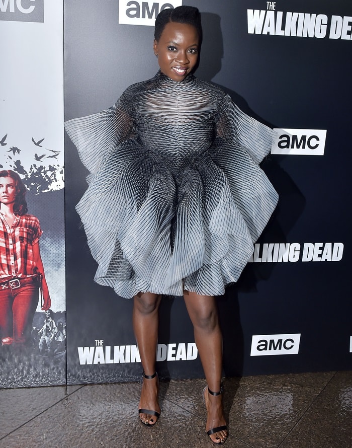 Danai Gurira stuns in a bold, sculptural Iris van Herpen dress paired with sleek black Christian Louboutin Jonatina sandals at The Walking Dead season nine premiere
