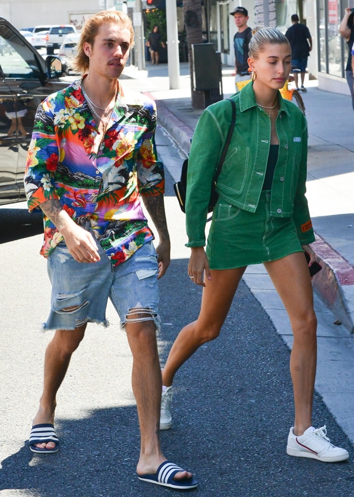 Hailey Baldwin flaunted her hot legs in a green Heron 'Preston' cotton crop denim jacket paired with a matching cotton workwear denim skirt