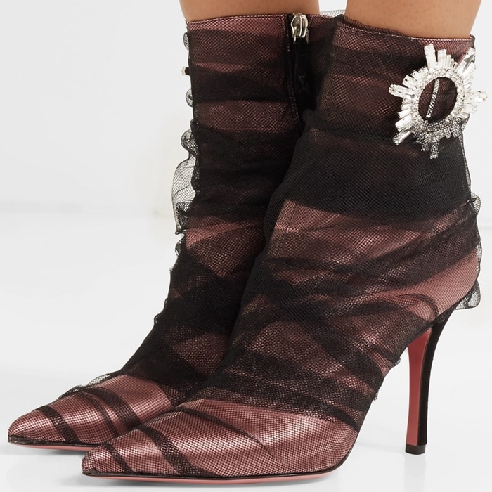 They rest on a contrasting suede heel and have a crystal-embellished brooch at the ankle